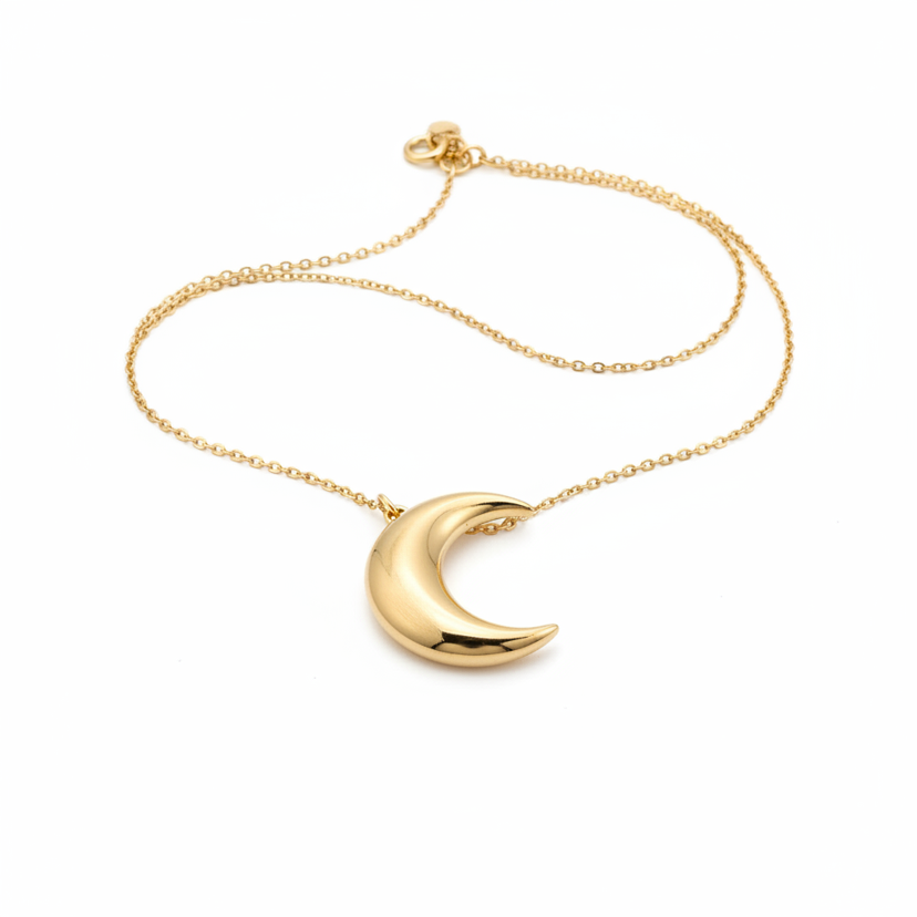 Dainty gold plated crescent moon pendant necklace on white background