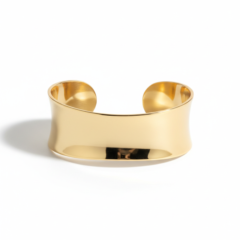 Wide gold plated cuff bracelet with smooth polished finish on white background